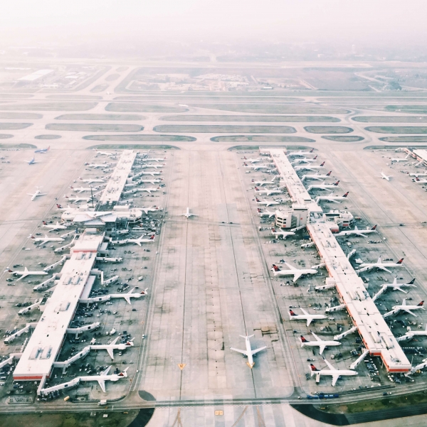 An airfield full of parked planes.